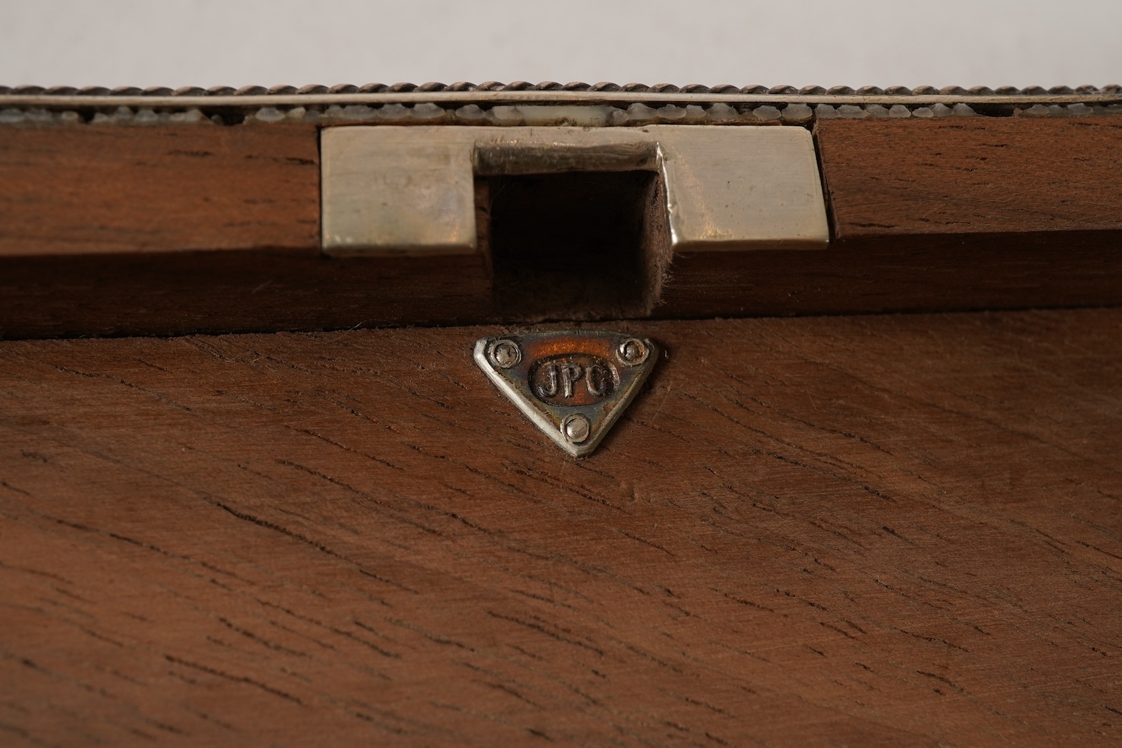 An early 20th century Arts & Crafts silver and shagreen mounted cigarette box with hinged cover, by John Paul Cooper